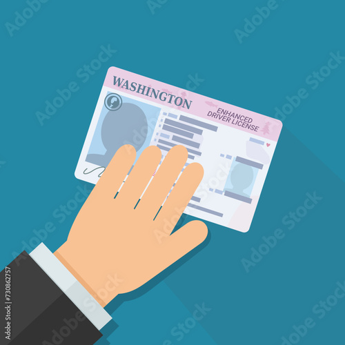A hand presents an enhanced driver's license from the US state of Washington in flat design style on blue background