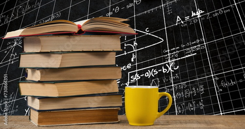 Digital composite of a yellow mug beside a pile of books on top of a wooden table while square patte