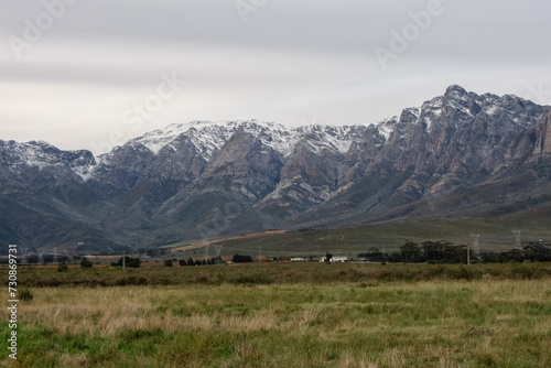 Snow-capped peaks of Breede Valley's distant mountains on a chilly day in Worcester, South Africa