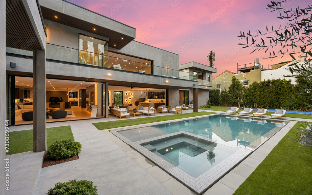 Modern home with a pool in the middle of the spacious yard