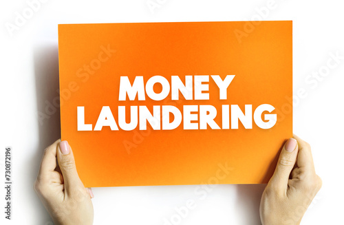 Money Laundering is the process of concealing the origin of money, obtained from illicit activities, text concept on card