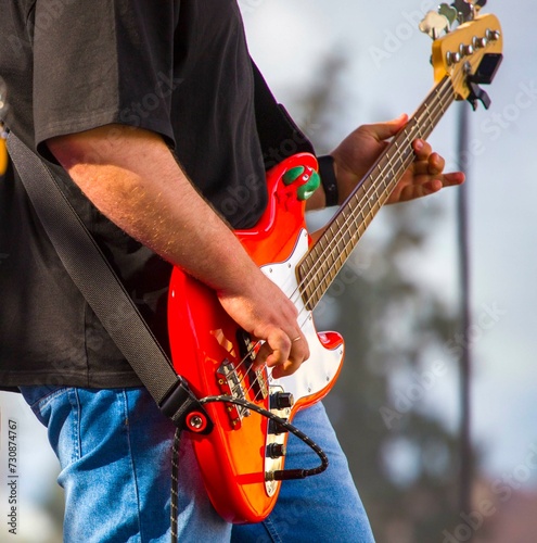 close-up of the hands of a musician playing an electric guitar