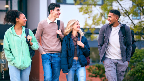 Photos Group Of University Students Outdoors Walking Past College Buildings