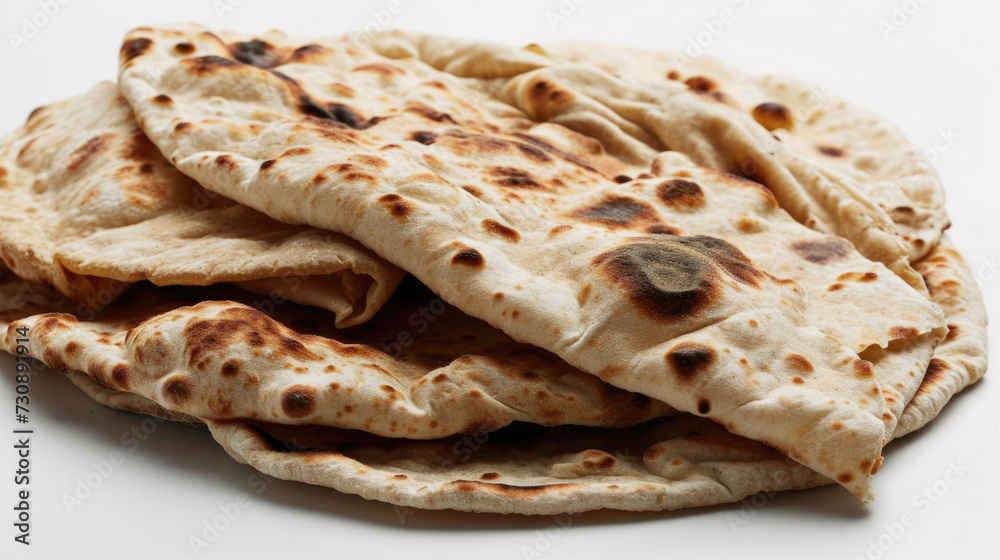 Pile of Flat Bread on White Table Pile of Flat Bread on White Table