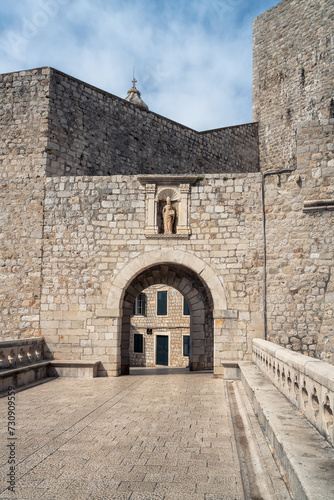 Amazing view with the beautiful old architecture of the old town of Dubrovnik on the coast of Adriatic Sea, Croatia. One of the many stone arched gates.