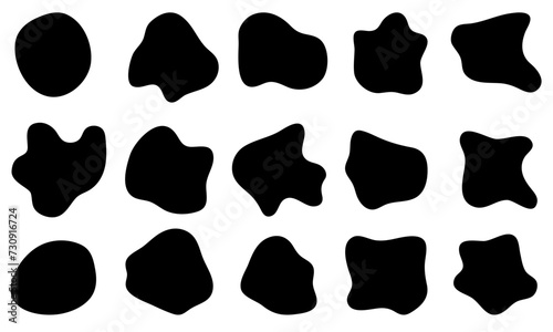 A set of irregularly shaped black spots. Organic and liquid simple shapes. Ink blots, drops, pebbles. Silhouettes on a white background.