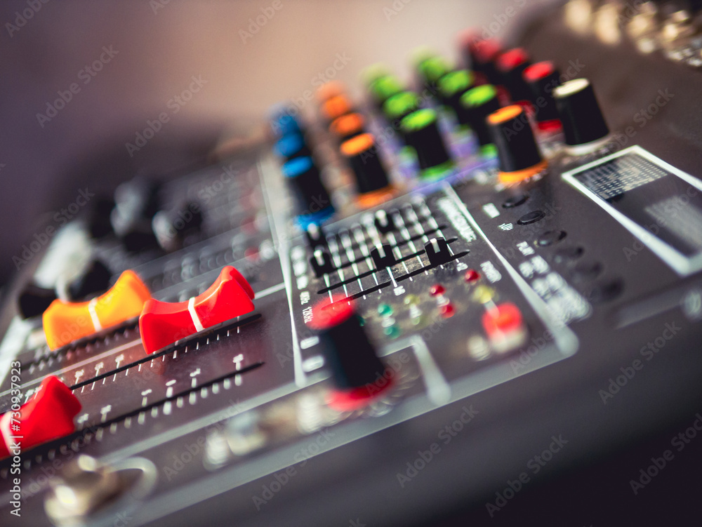 Close-up of sound recording equipment knobs.Mixer control. Music engineer. Backstage controls on an audio mixer, Sound mixer. Professional audio mixing console, buttons, faders and sliders.