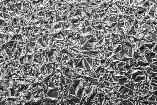 Crumpled shiny metal foil texture