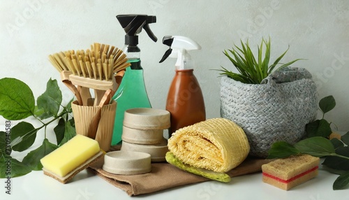 cleaning concept with eco friendly cleaning tools on white background