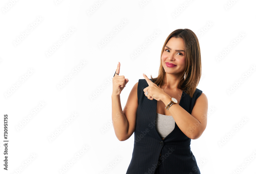 Successful and confident Latina businesswoman looking at camera pointing to copy space Successful and confident Latina businesswoman looking at camera pointing to copy space