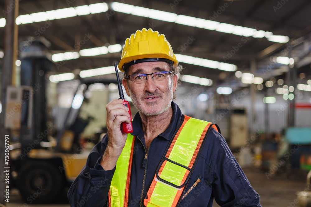 engineer use walkie talkie at machine factory engineer use walkie talkie at machine factory