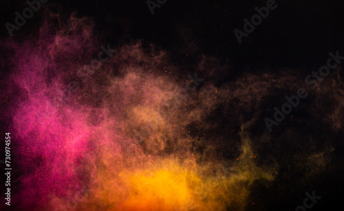 Orange pink powder dust on a black background