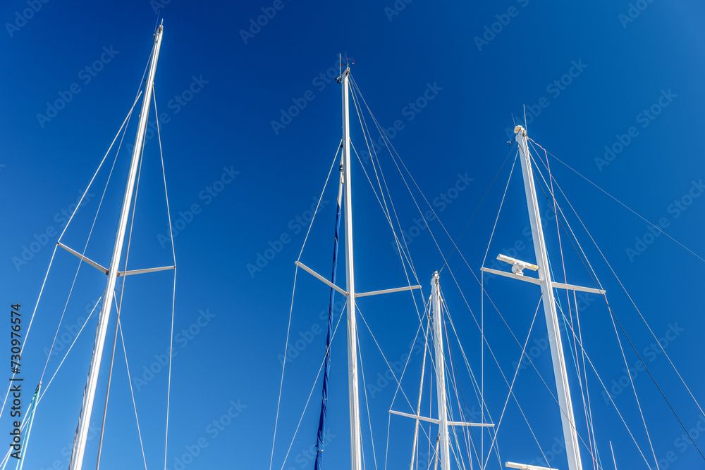 several masts of a yacht without sails several masts of a yacht without sails