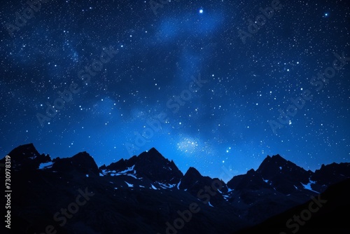 Twinkling stars scattered across the night sky, framing a silhouetted mountain range