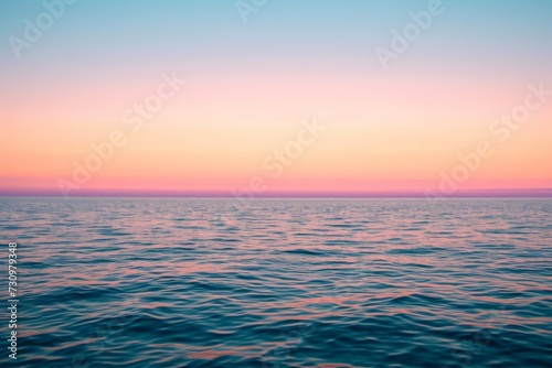Soft pastel sunset, blending hues, over calm ocean horizon