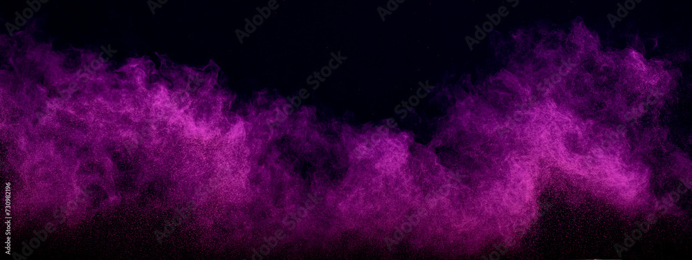 Purple powder dust smoke on black background