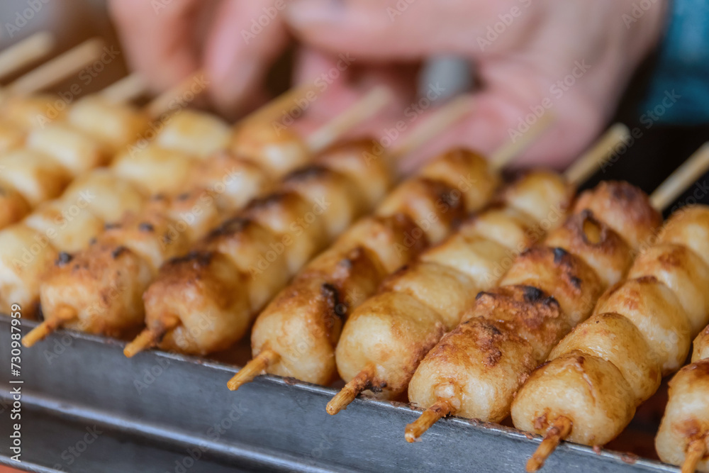 Mitarashi Dango are traditional Japanese rice dumplings on a bamboo skewer coated in a sweet soy glaze. Mitarashi Dango are traditional Japanese rice dumplings on a bamboo skewer coated in a sweet soy glaze.