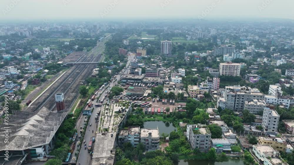 Aerial perspective of Rajshahi city in Bangladesh, nestled by the serene banks of the Padma River. Marvel at its vibrant urban landscape, rich heritage in this captivating drone footage. 4k Aerial perspective of Rajshahi city in Bangladesh, nestled by the serene banks of the Padma River. Marvel at its vibrant urban landscape, rich heritage in this captivating drone footage. 4k