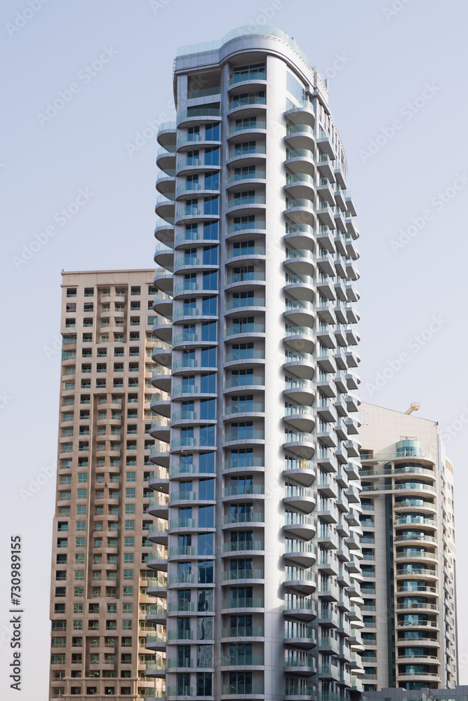 Quarter of multi-storey residential buildings of standard construction. View of new high-rise buildings against the blue sky.