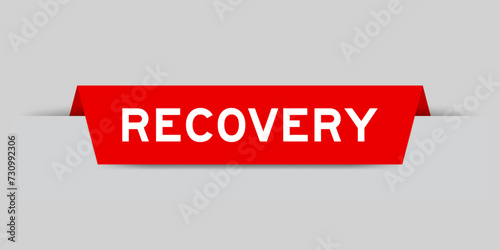 Red color inserted label with word recovery on gray background
