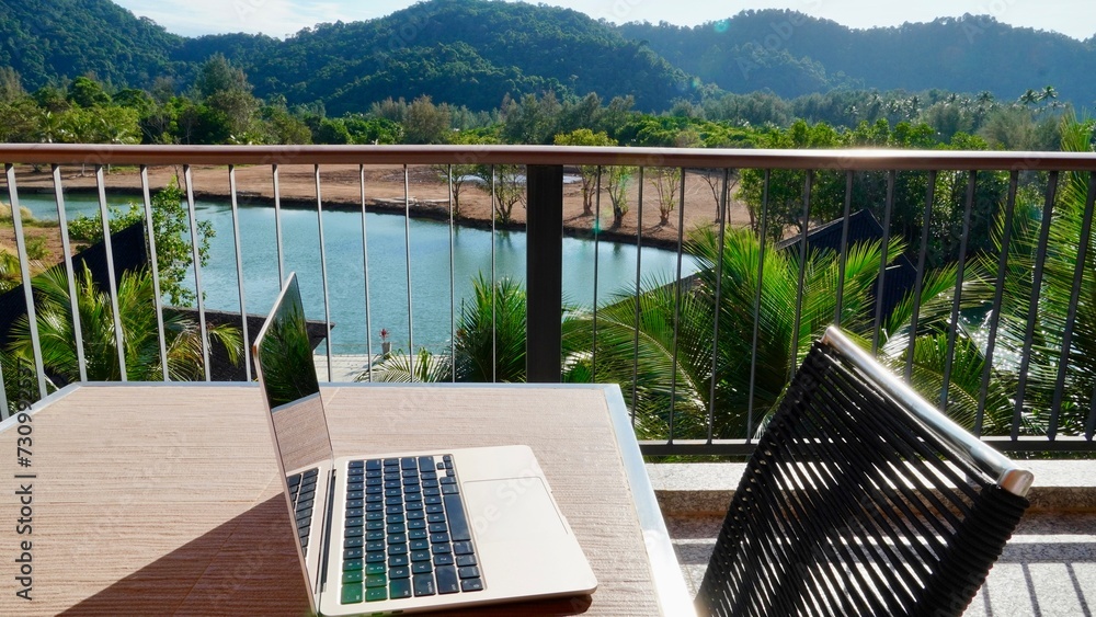 Laptop work remote remote office computer IT, travel with laptop office with lake mountains and palms remotely work education balcony with view Thailand - obrazy, fototapety, plakaty 
