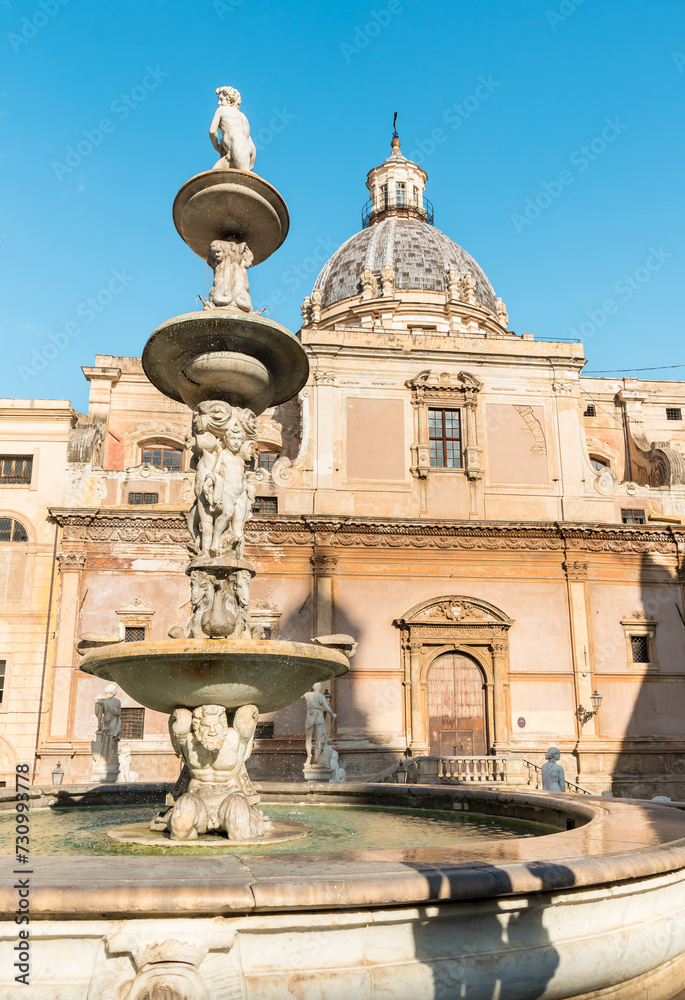 View of Saint Catherine church with the marble statue of the Pretoria fountain ahead, Palermo, Sicily, Italy