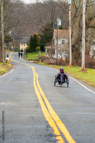 Wallpaper Mural Lone person on recumbant bicycle moving away from camera Torontodigital.ca