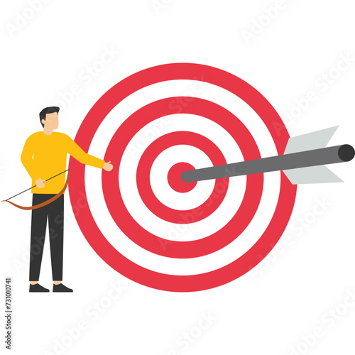 Reaching targets, achieving goals or success in business, teamwork in achieving targets or goals. aim to hit the target bullseye concept, the business team with arrows stuck on a big target.