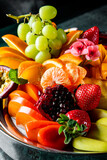 Assortment set of juicy fruits on plate