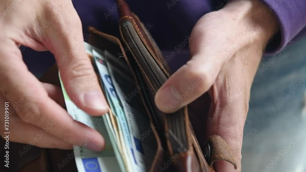 Male hands with wallet counting cash euro money close-up. The concept of savings accumulation. Financial crisis. Male hands with wallet counting cash euro money close-up. The concept of savings accumulation. Financial crisis.
