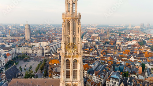 Antwerp, Belgium - July 21, 2023: Spire with the clock of the Cathedral of Our Lady (Antwerp). City Antwerp is located on river Scheldt (Escaut). Summer morning, Aerial View