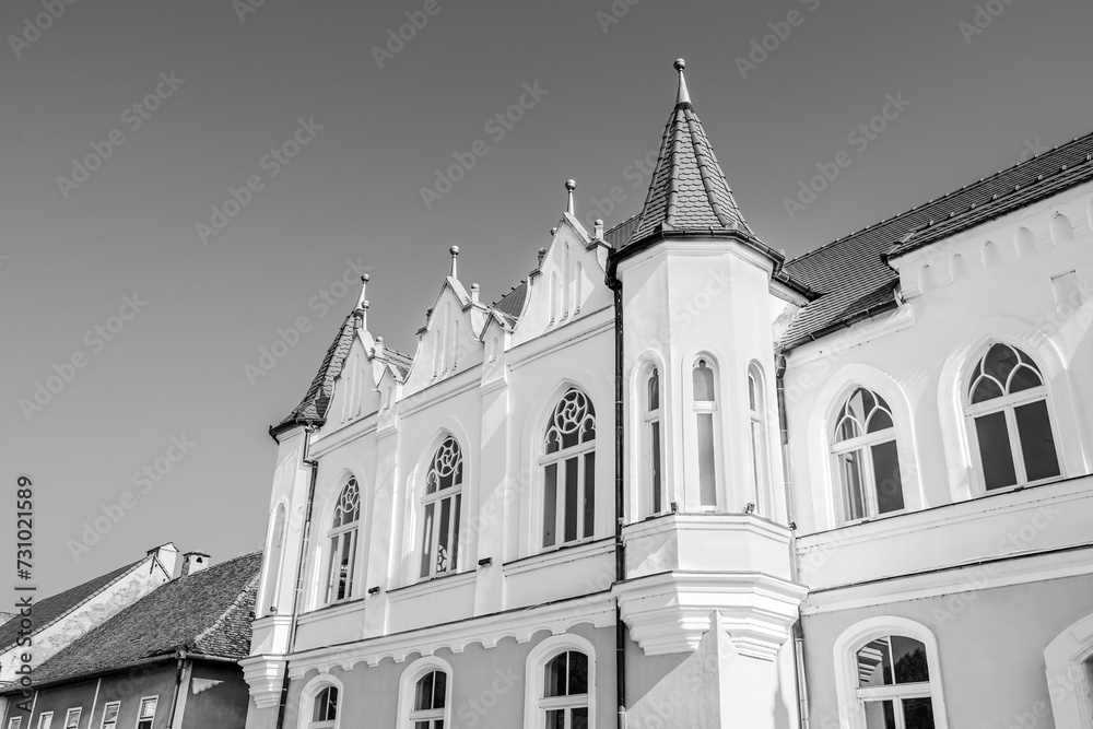 Facade of the town hall building in Sebeș, Alba county, Transylvania, Romania inblack and white