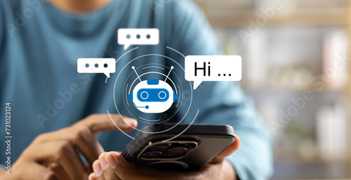 AI Artificial Intelligence,Digital chatbot, Man chatting with digital assistant chatbot on mobilephone on internet application,Future of customer service man utilizes AI chatbot for instant assistance photo