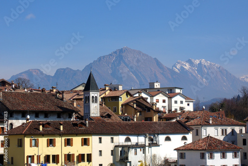 View of the city of Belluno with the Dolomites in the background. Veneto, Italy