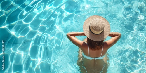 Woman relaxing in a beautiful swimming pool