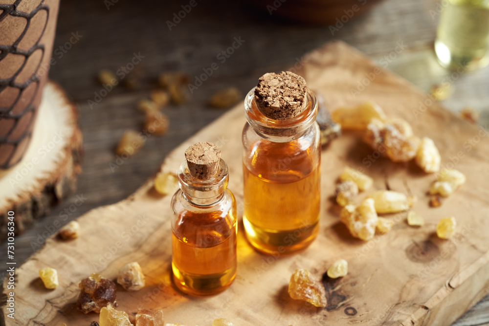 Two bottles of frankincense essential oil with boswellia resin Two bottles of frankincense essential oil with boswellia resin