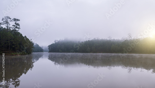 Beautiful view of sunrise over the lake in park, Thailand.