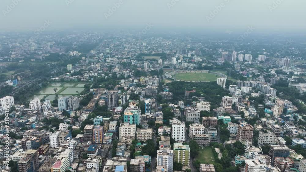 Aerial perspective of Rajshahi city in Bangladesh, nestled by the serene banks of the Padma River. Marvel at its vibrant urban landscape, rich heritage in this captivating drone footage. 4k Aerial perspective of Rajshahi city in Bangladesh, nestled by the serene banks of the Padma River. Marvel at its vibrant urban landscape, rich heritage in this captivating drone footage. 4k