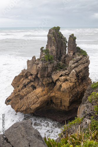 pancake rocks with seagulls on cloudy day