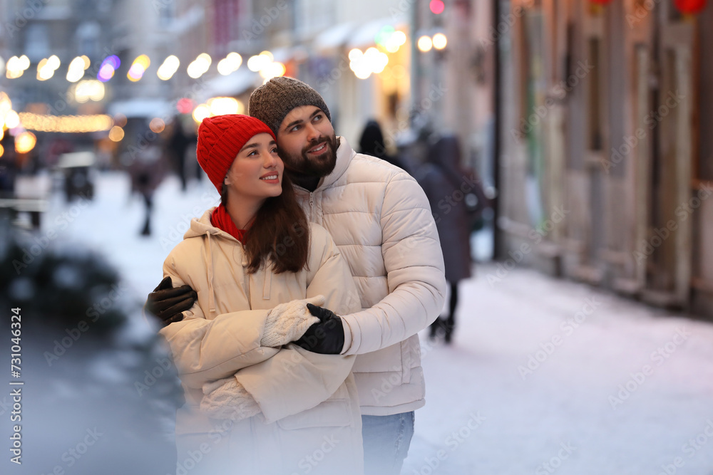 Lovely couple spending time together on city street