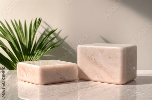 Two Marble podiums. Pink pastel background to stage cosmetic product. Empty flat showcase display case. Mockup pedestal trendy backdrop. Floor smooth platform, palm leaf. Natural ad show scene space