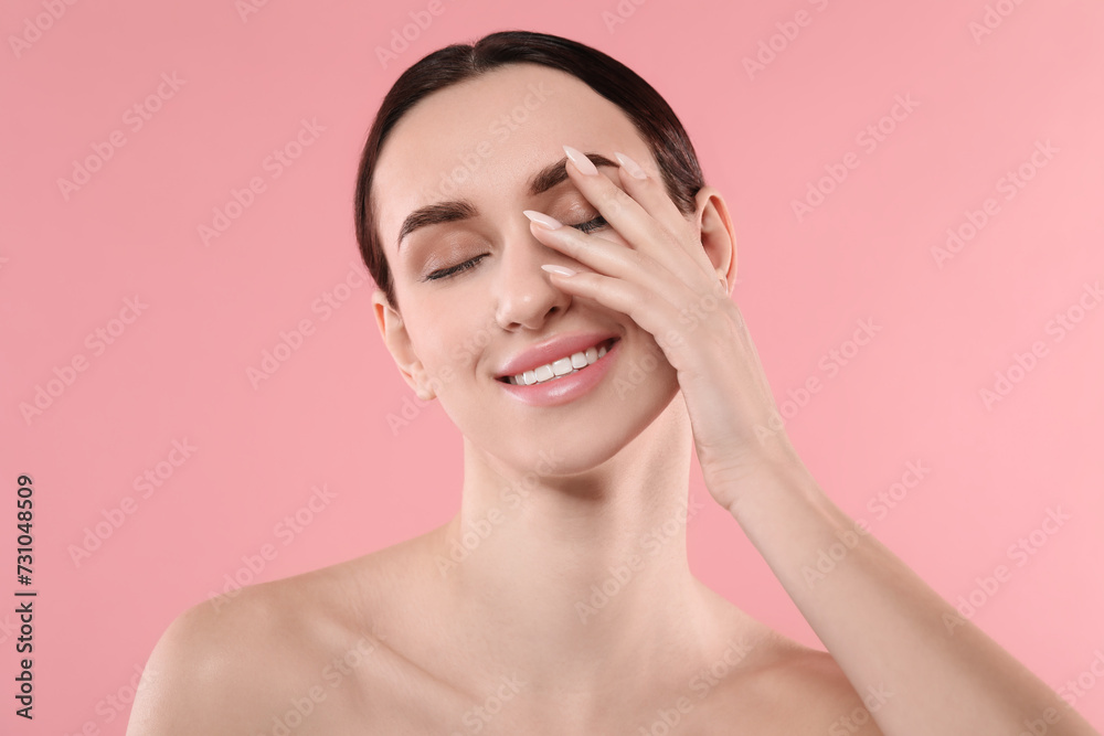 Portrait of beautiful young woman on pink background Portrait of beautiful young woman on pink background