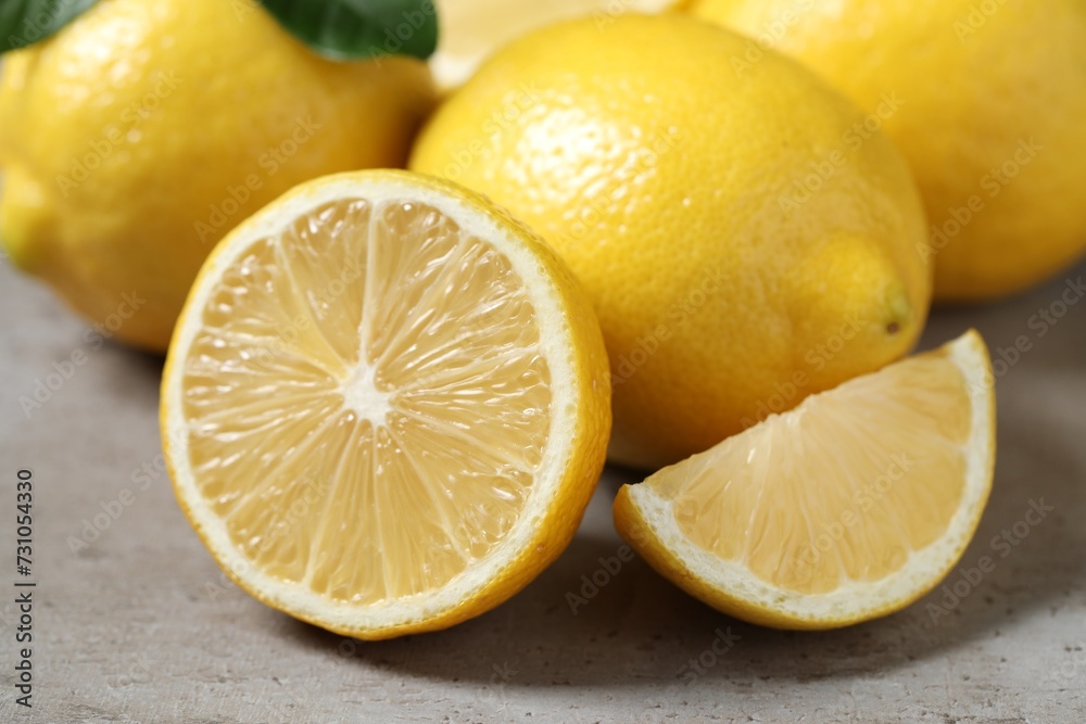 Fresh lemons on grey table, closeup. Citrus fruit Fresh lemons on grey table, closeup. Citrus fruit