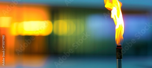 Blurred sports arena with olympic torch flame and space for text placement in a vibrant atmosphere