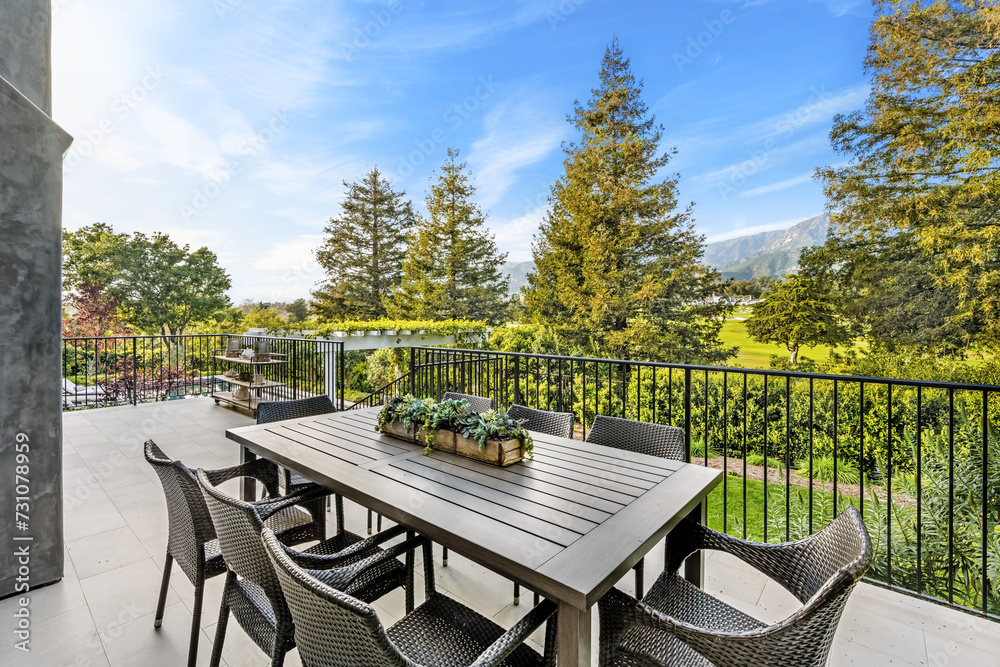 Deck with outdoor dining set overlooking scenic vineyard Deck with outdoor dining set overlooking scenic vineyard