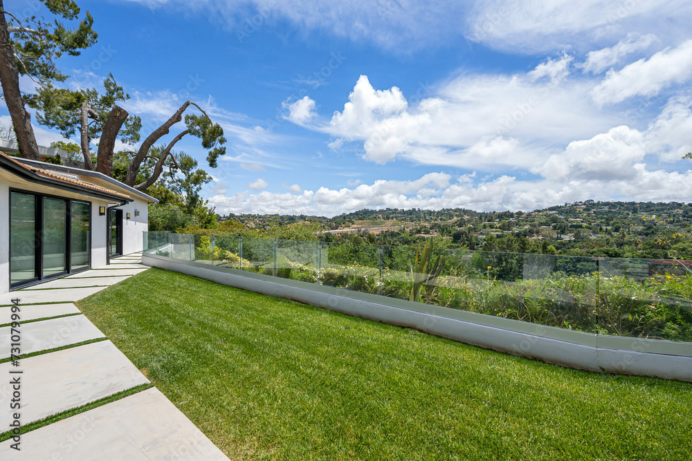 Charming house nestled alongside a lush, grassy hillside Charming house nestled alongside a lush, grassy hillside