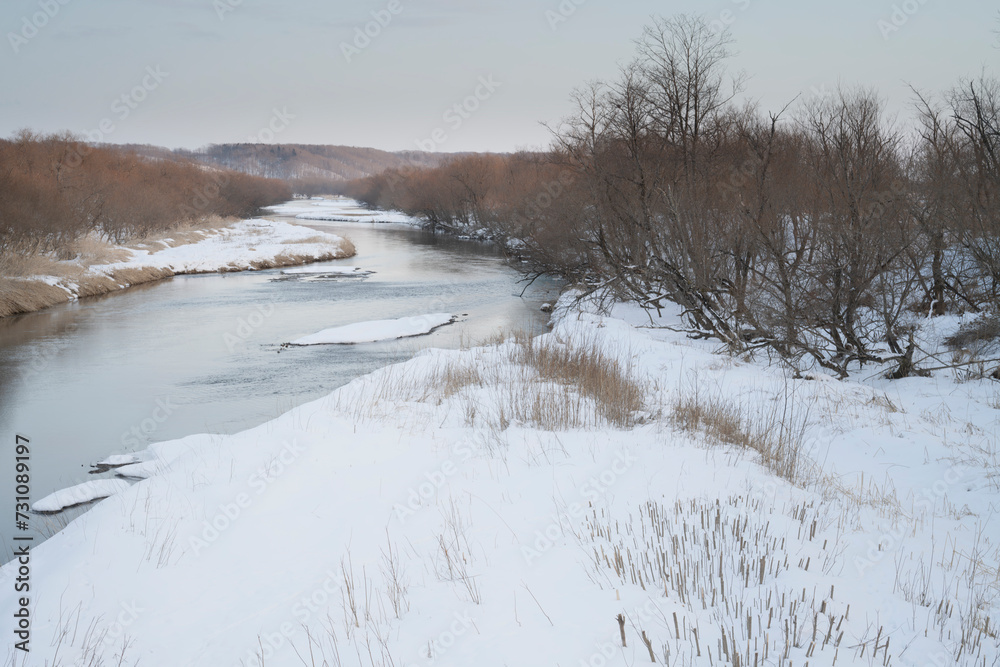 Wintery landscape of river bed at Kushiro, Tsurui, Hokkaido, Japan at Otowa bridge. Wintery landscape of river bed at Kushiro, Tsurui, Hokkaido, Japan at Otowa bridge.