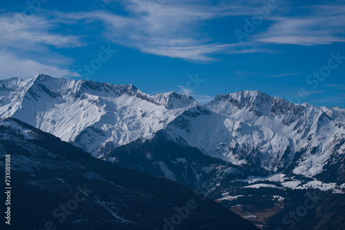 Fototapeta Naklejka Na Ścianę i Meble -  out in nature - beautiful view from the mountains to a valley and the alps, the hohe tauern in the national park in austria, at a beautiful winter day
