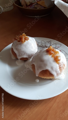 Baked donuts with rose and icing.  © Mary