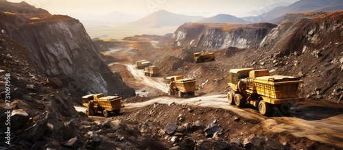 top view of mining trucks and excavators in gold mining pit photo